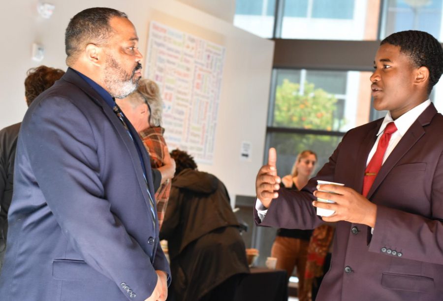 Interim President Damon Bell (left) speaks with Associated Student President Preston Akubuo-Onwuemeka during a meet-and-greet session for the new president at Fireside Hall Monday.