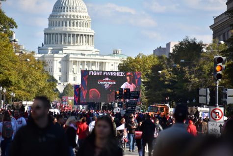 Large video screens near the U.S. Capitol display images of the Washington Nationals World Series victory parade on Nov. 2. The screens were placed to show the final phase of the parade, when the players and front office staff gave speeches, allowing those unable to find a seat to watch. 