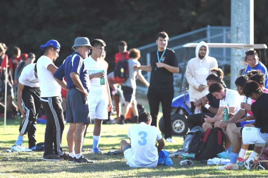 Former 
men’s soccer 
coach Rudy
Zeller 
(left middle)
places his hands on his hips as the squad sits on their bench during a game this season. Zeller ended his term as coach at halftime during a game against Napa Valley on Oct. 4. 