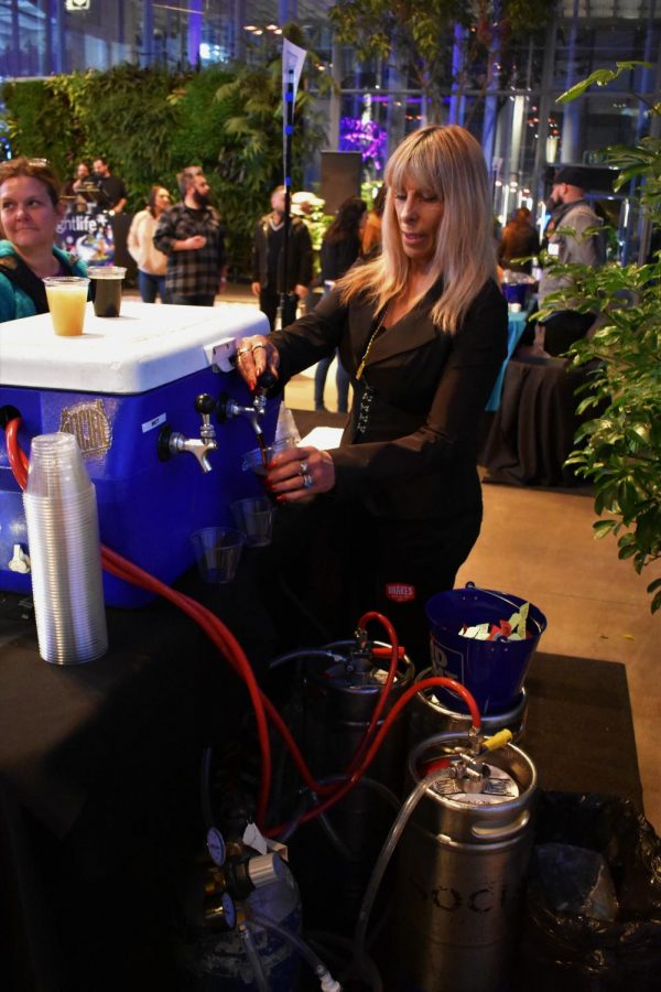 A Bartender pours a cup of San Franciscos own Social Kitchen & Brewery. Man companies carried their alcohol in coolers.  