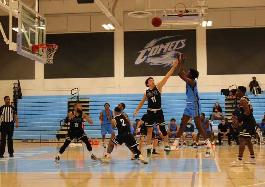 Sophomore guard John Wade ll shoots a mid range jump shot over a Butte College defender in San Pablo on Tuesday, Dec. 7. (Photo/Joseph Porrello)