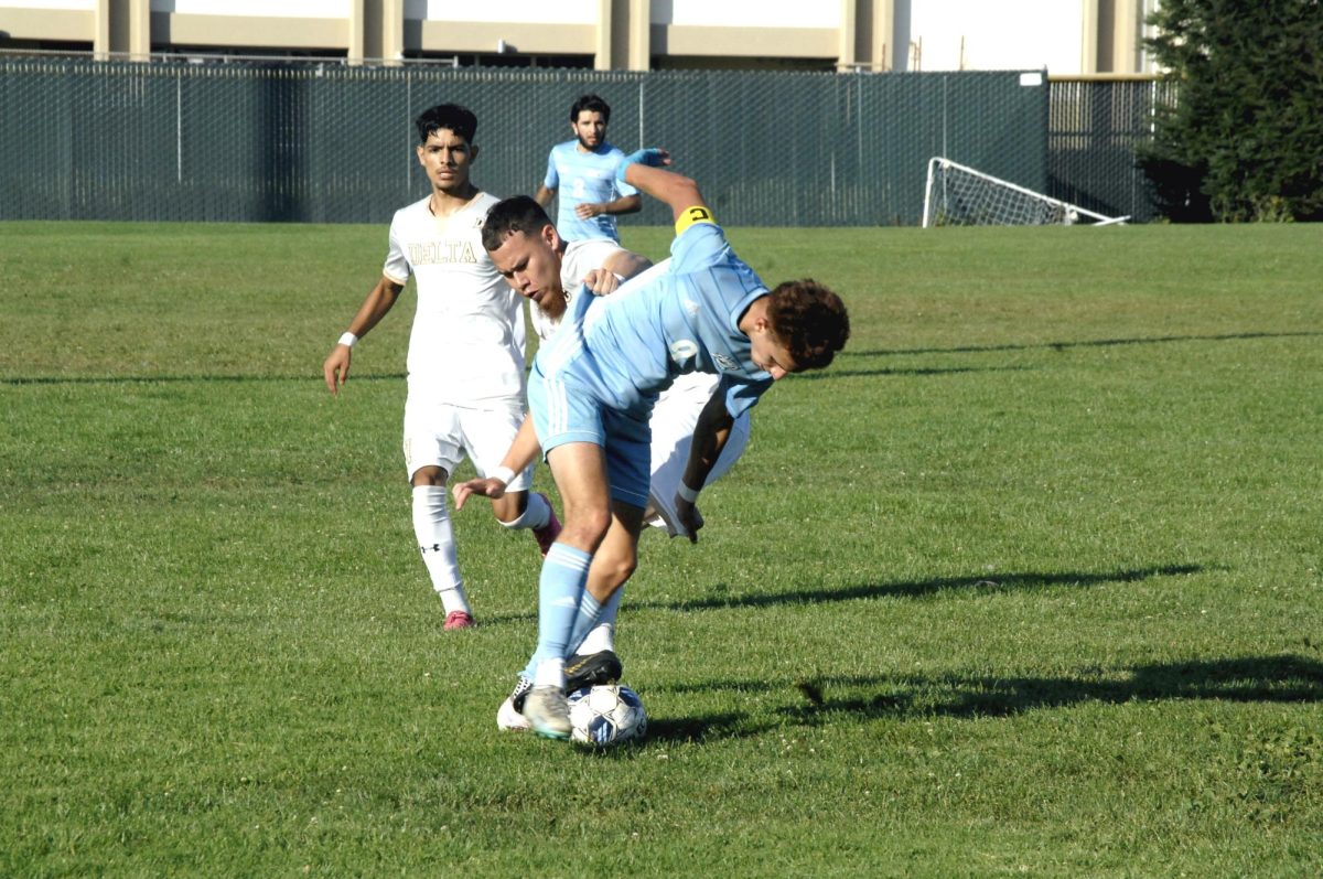 Contra Costa Comet player no#. 9, Mark Salagado (Forward) determine to keep the ball, from Delta College player.

San Pablo Ca 15 September 2023, CCC vs Delta College
