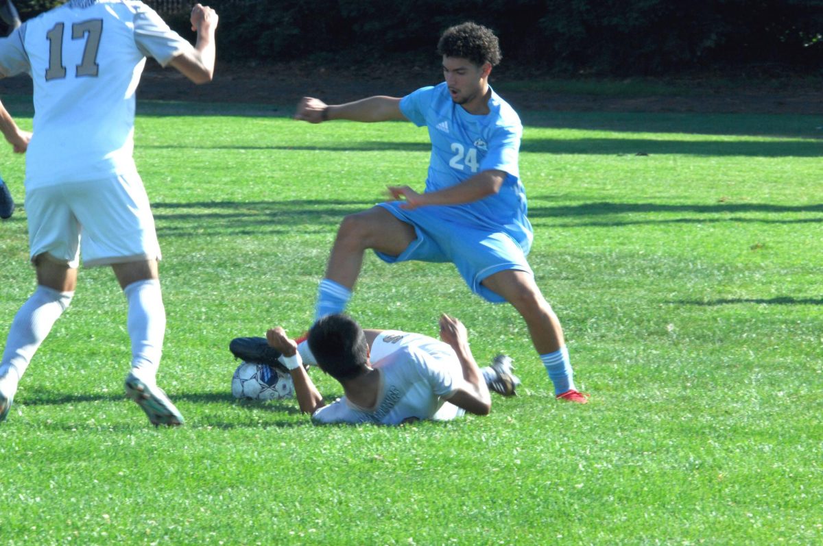 Contra Costa Comet player no#. 24, Paulo Souza (Forward)
shows his agility in holding on to the ball and not injuring Delta College player.

San Pablo Ca 15 September 2023. CCC vs Delta College