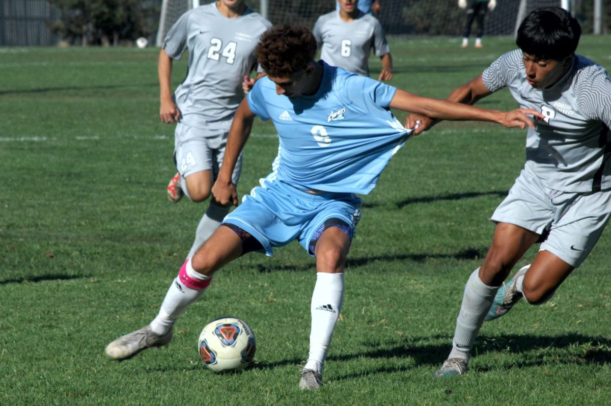 Contra Costa player no#. 9, maintains even with the grip of a Foothill player.

San Pablo Ca 05 September 2023 CCC vs Foothill