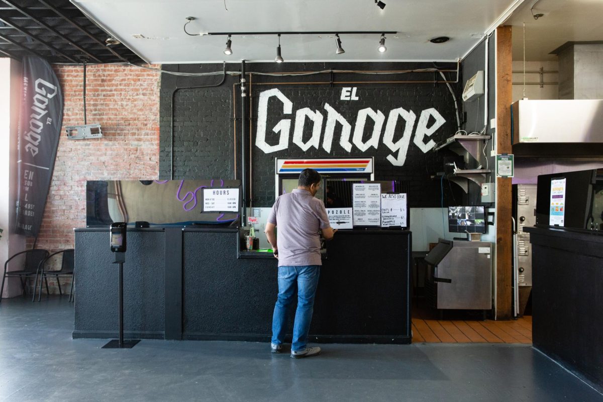 A customer stands at the counter of El Garage in Richmond, Calif. on September 10, 2023.