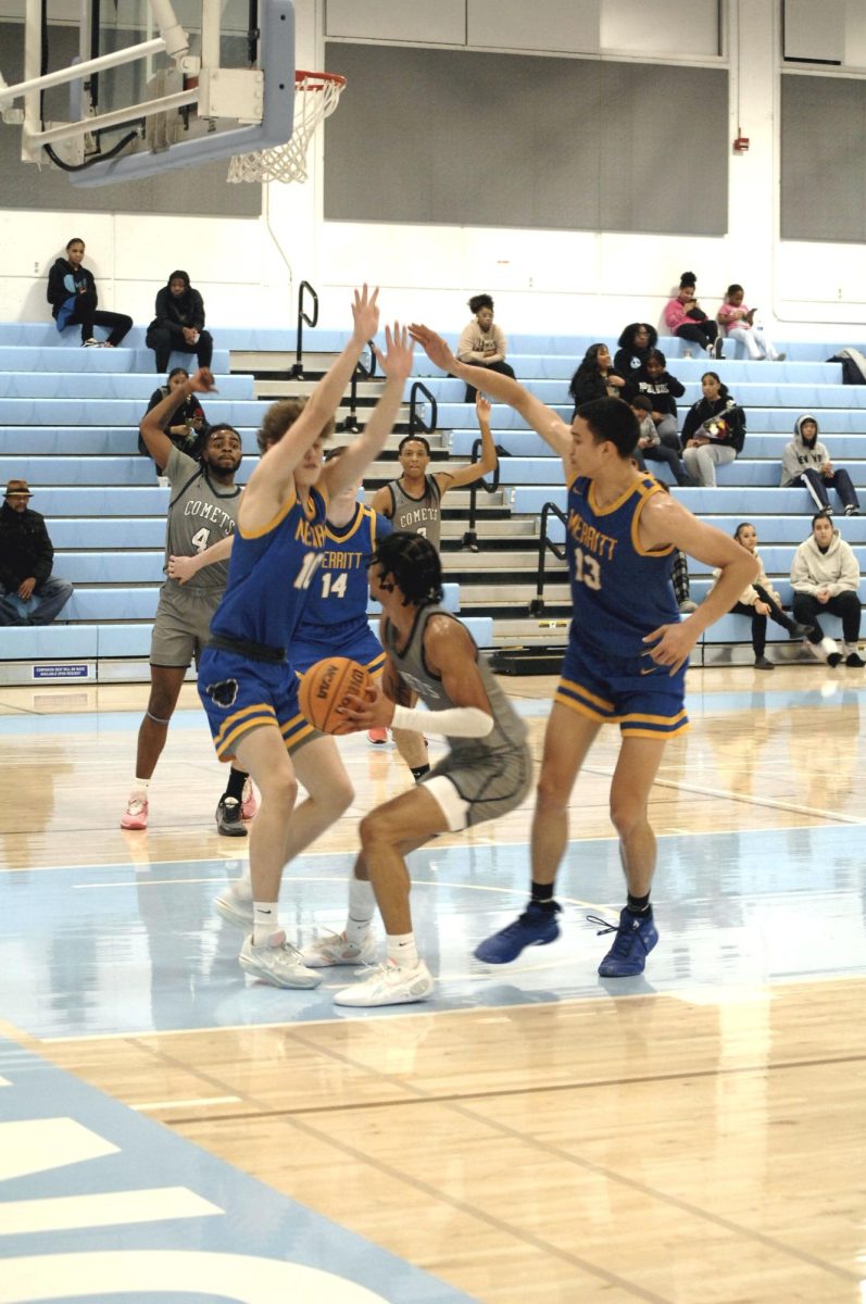 Contra Costa Comet player no#. 1 G Mikey Pierce is undeterred by Merritt College players, attempting to block the shot 

San Pablo Ca 26 January 2024, Contra Costa College, Men’s Basketball game vs. Merritt College 
