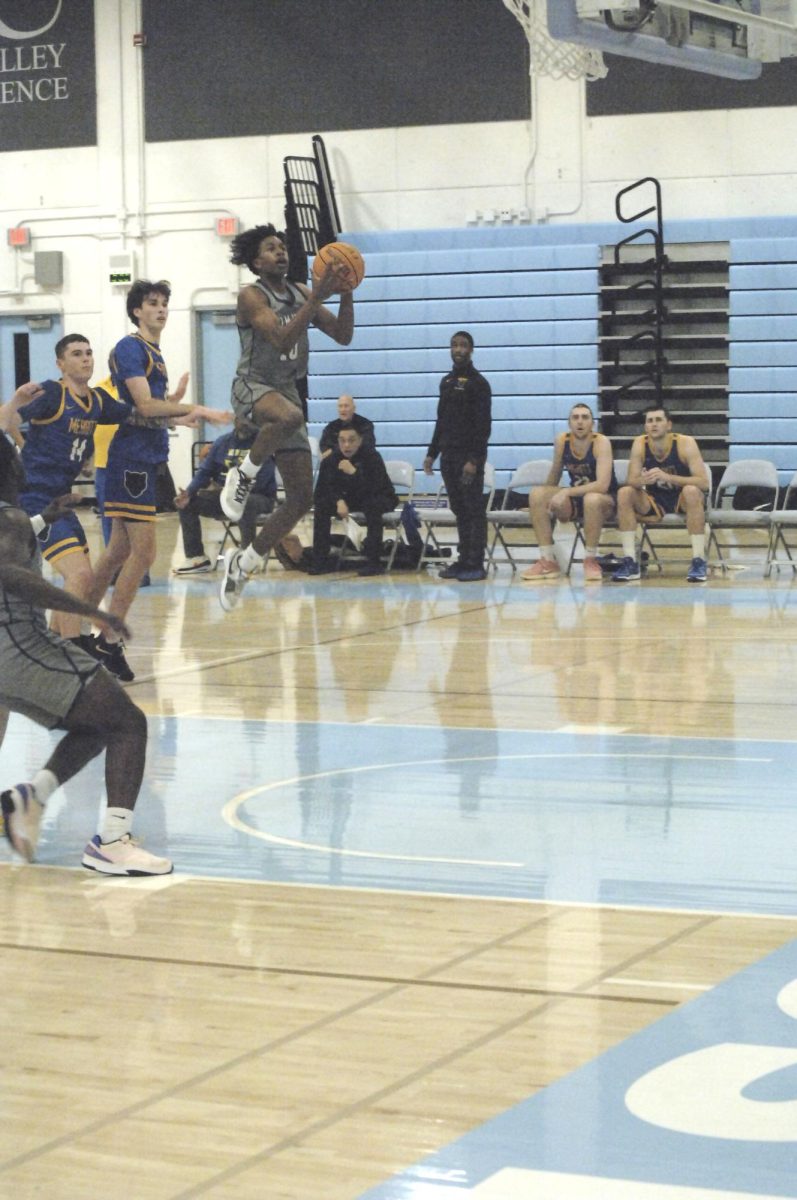 Contra Costa Comet player no#. 10 PG Joseph Gould shows Merritt College players, how to walk on air to score point. 

San Pablo Ca 26 January 2024, Contra Costa College, Men’s Basketball game vs. Merritt College 
