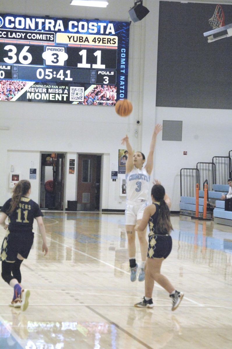 The Lady Comet player, No.# 3 goes airborne for the point.
Contra Costa College, Womens Basketball game vs. Yuba College, San Pablo Ca 20 February 2024
