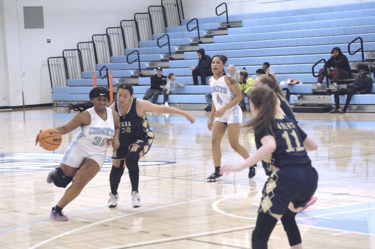 Lady Comet player, # 32 shows that she is a force to be reckoned with during the  Contra Costa College vs. Yuba College game, at San Pablo, CA, Tuesday, February 20, 2024. 