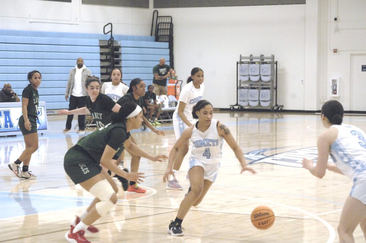 The Lady Comet player, No.# 4 ensure her teammate received the pass. Contra Costa College, Womens Basketball game vs. Laney College, San Pablo Ca 22 February 2024
