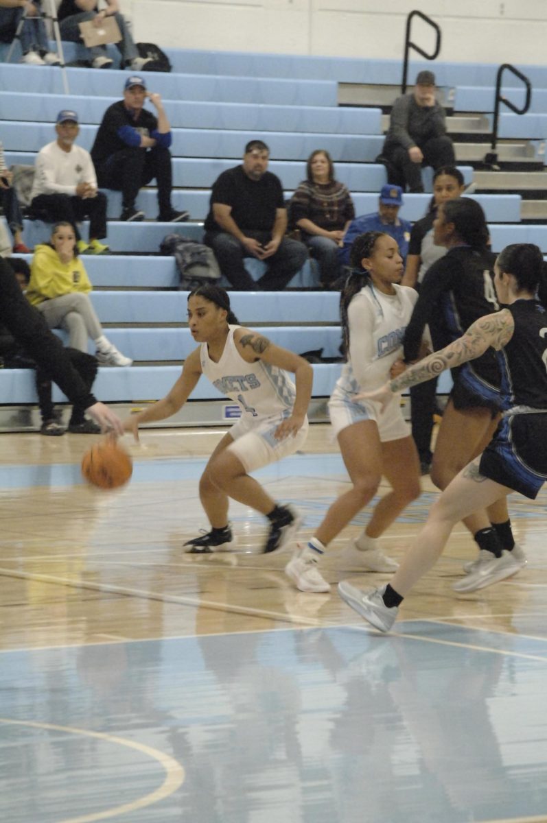 The Lady Comet, player no#. 4 takes control, while teammate gives supported in driving home another point.

San Pablo Ca 14 February 2024, Contra Costa College, Womens Basketball game vs. Solano College