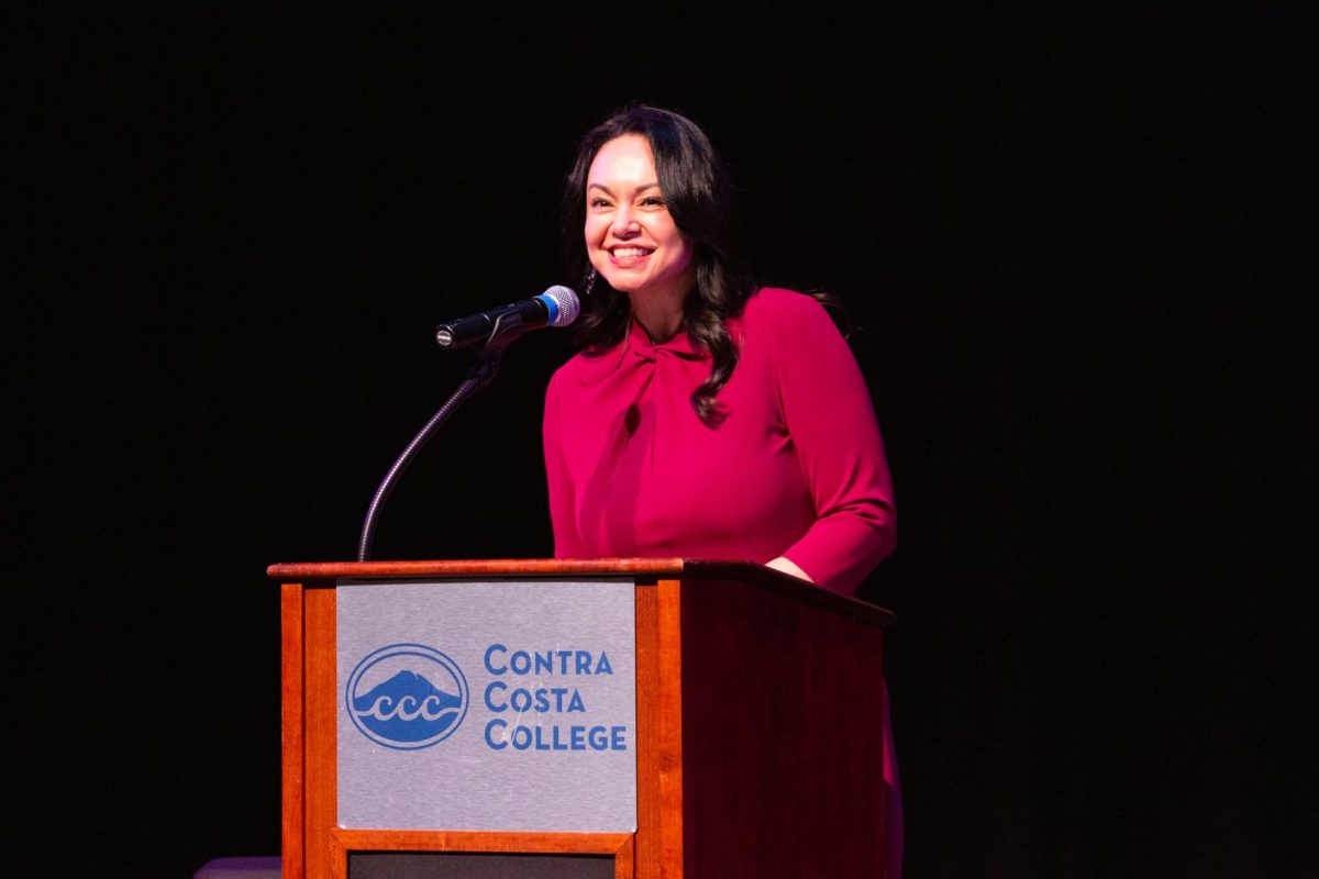 Mayra Padilla, Senior Dean, Planning & Special Programs at Contra Costa College, speaks to the audience at an event featuring author Heather McGhee on Tuesday, Feb 13, 2024, in San Pablo, CA. 