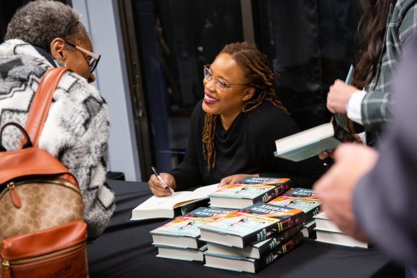 Author Heather McGhee signs copies of her book, The Sum of Us, after speaking to an audience at Contra Costa College on Tuesday, Feb. 13, 2024, in San Pablo, CA. 