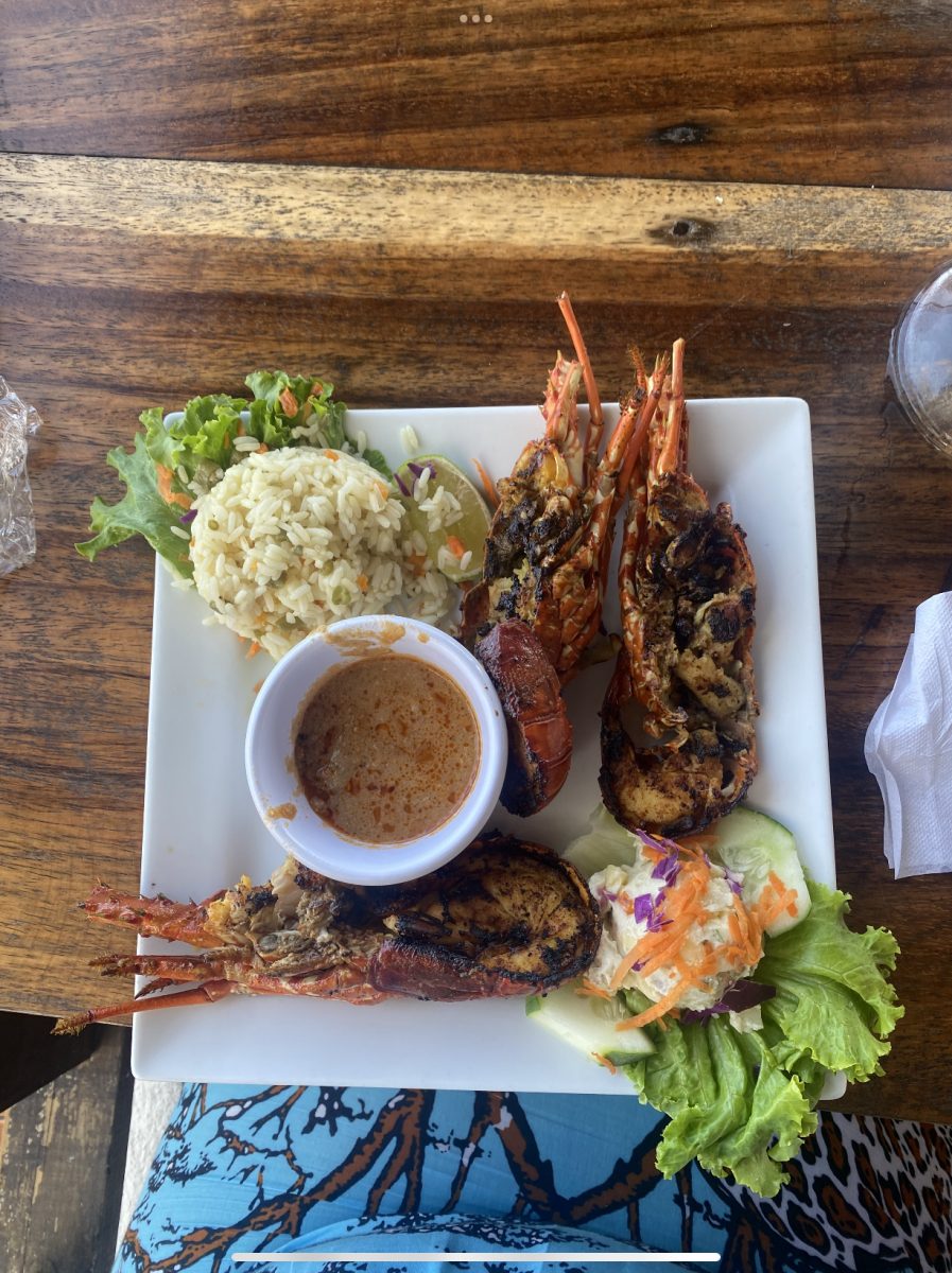 Three garlic lobsters with a side of classic Salvadorian rice served at La Curva de Don Gere restaurant in La Libertad, El Salvador, on Wednesday, July 26, 2023.