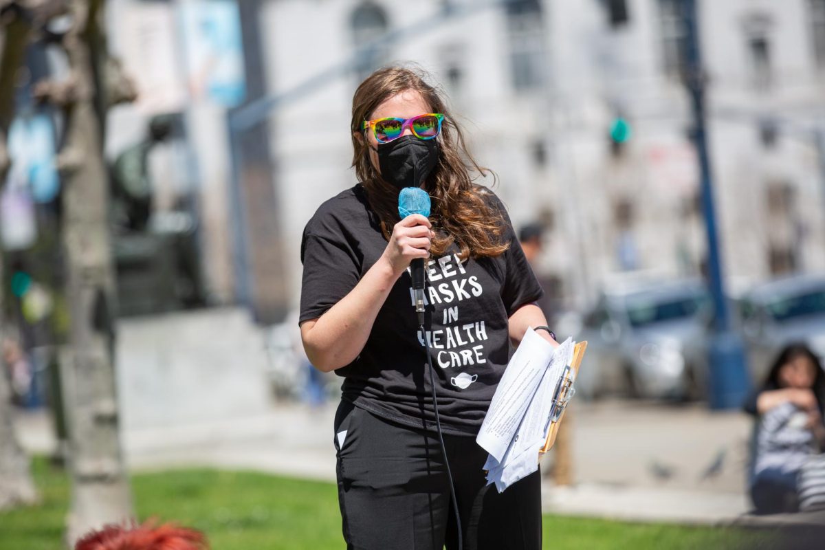 Allegra Heath-Stout, a member of Senior and Disability Action, speaks to demonstrators outside San Francisco City Hall on April 16, 2024 in San Francisco, Calif.
