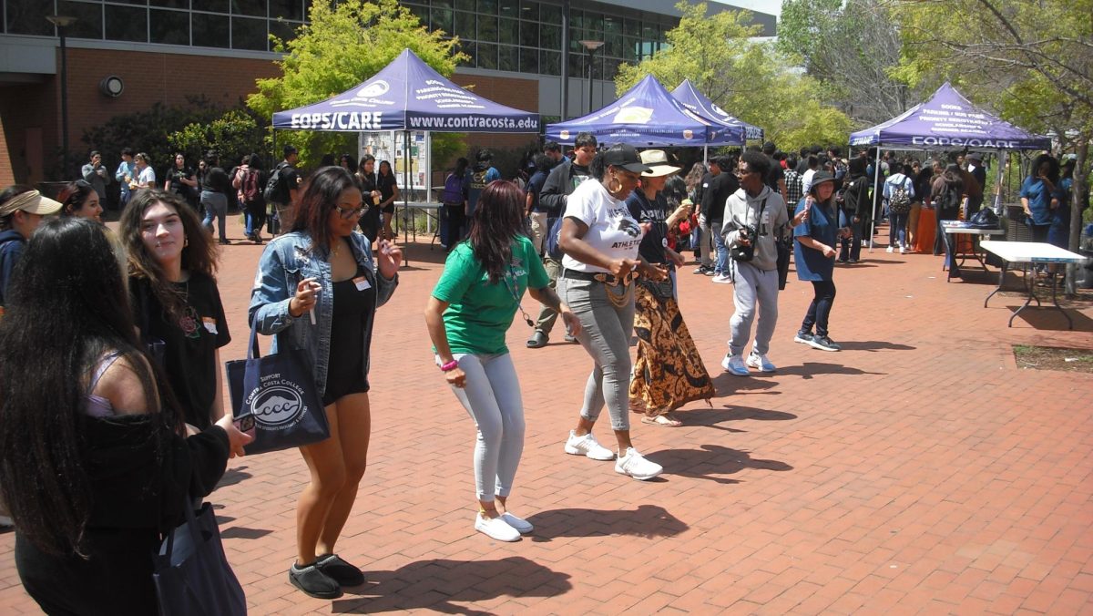 Some of the attendees are seen enjoying the music and dancing during Comet Day at Contra Costa College in San Pablo, CA, on Thursday, April 18, 2024.