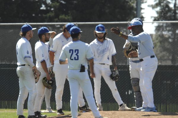 Comets Head Coach, Albert Strane, called in the team from the outfield, to give defensive tactics, against Los Medanos players, during the Contra Costa College vs. Los Medanos College baseball game on Thursday, April 11, 2024, in San Pablo, CA.