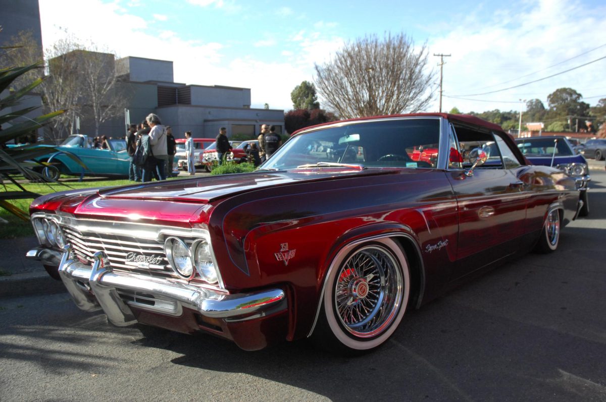Attendees enjoying some of the lowriders that were present in the car show during the American Homeboy event in the Knox Performing Arts Center at Contra Costa College in San Pablo, CA, on Friday, April 12, 2024.