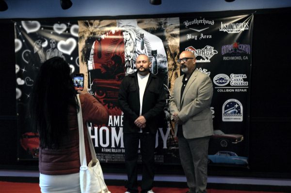 Film director, Brandon Loran Maxwell along with cast member John Ulloa taking a photo during the American Homeboy event in the Knox Performing Arts Center at Contra Costa College in San Pablo, CA, on Friday, April 12, 2024. 