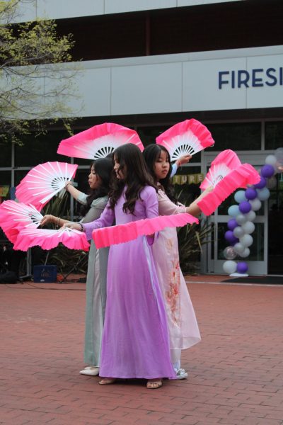 Vietnamese students perform with Quạt tay during Middle College High School Culture Night in Richmond, Calif., Thursday, April 25, 2024. A self-choreographed dance reflective of historically significant traditional Vietnamese fan dances. (Middle College High School Yearbook/Maxwell Stemmle)