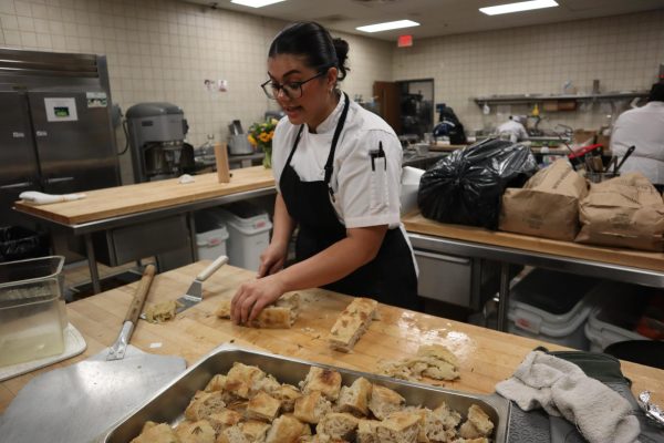 Kayla Pule preps bread in the culinary building bakery at Contra Costa College in San Pablo, Calif., April 21, 2024. (Shawn Williams/The Advocate)