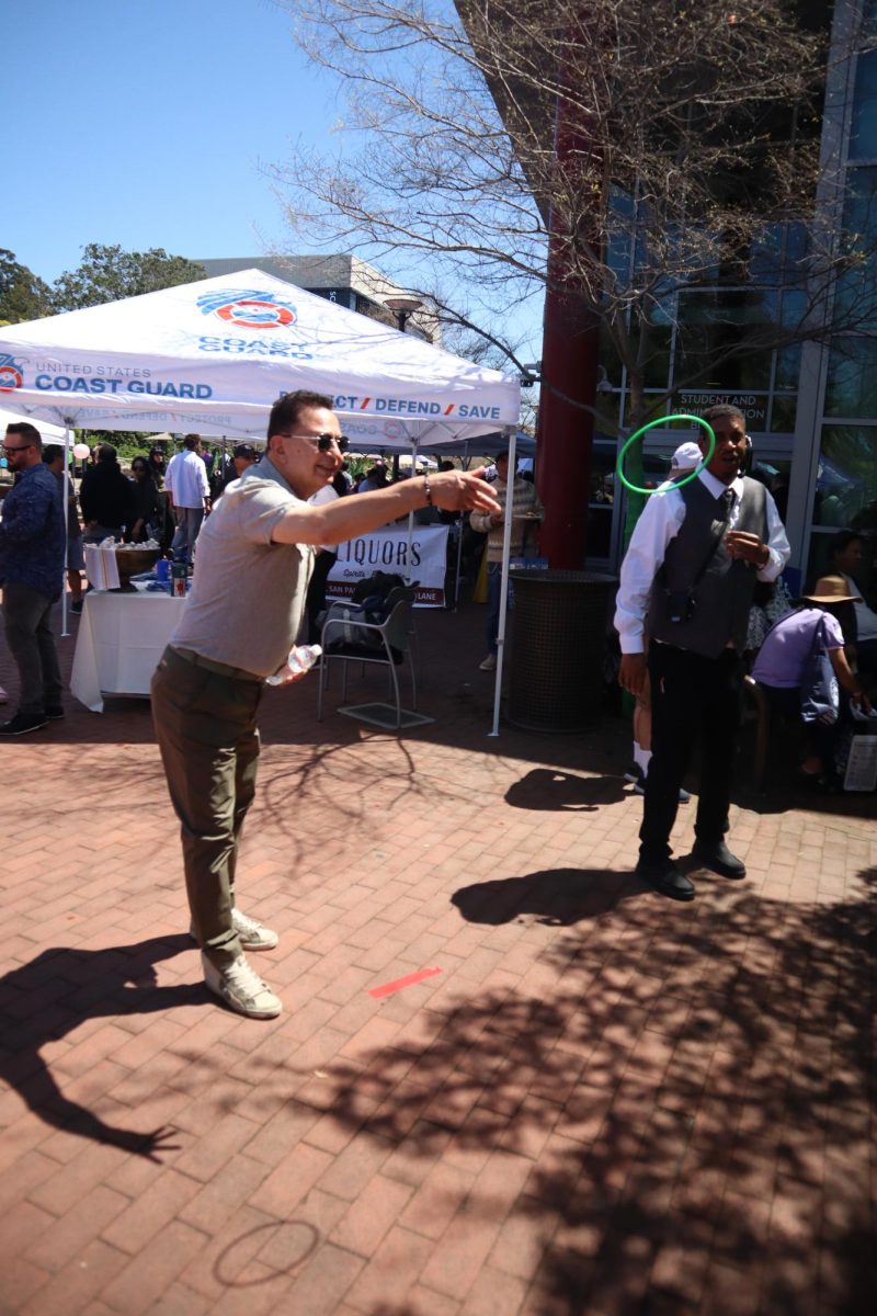 chef nader sharkes taking part in the wine ring toss at food and wine event, april 21st