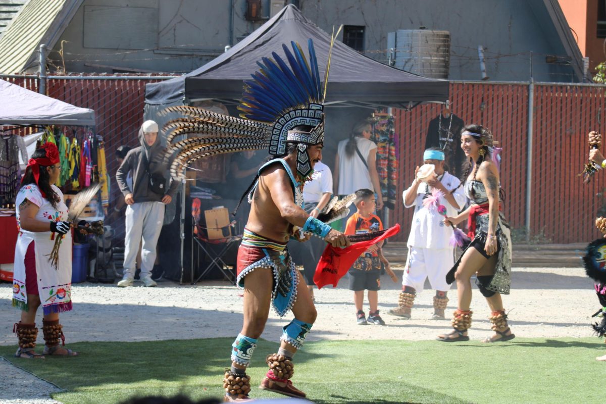 Calpulli Coatlicue dancers performing at the Indigenous Red Market in Derby Ave. in Oakland, Calif., on Oct. 6,2024