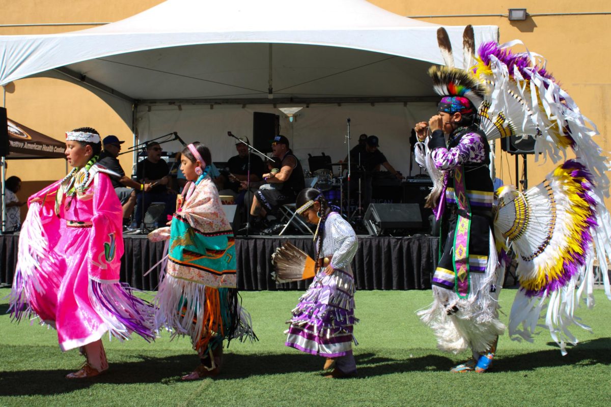 From left to right Joanne, Lynn, Eliana, and Matthew coming in as they are introduced by the singers at the Indigenous Red Market in Derby Ave. in Oakland, Calif., on Oct. 6,2024