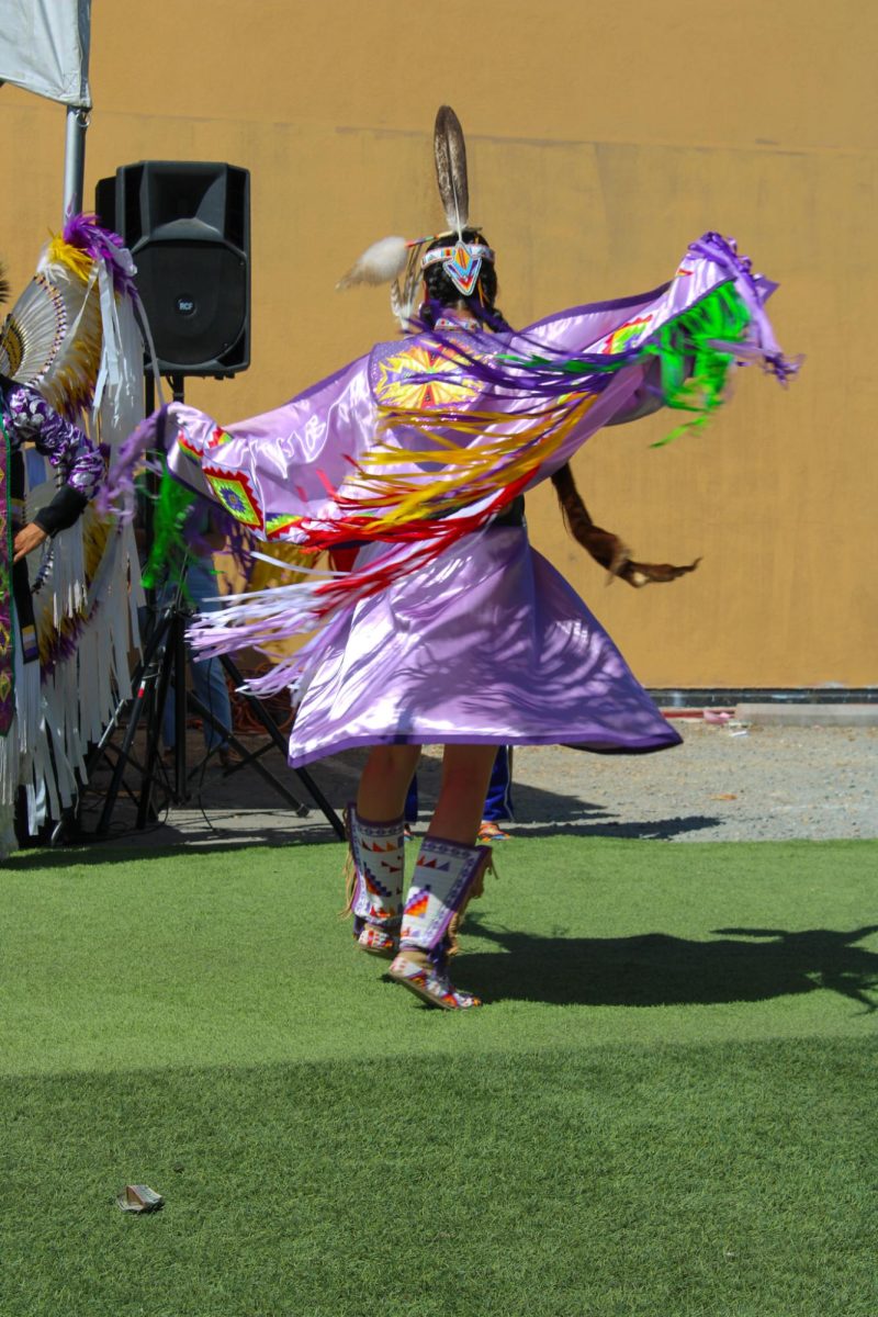 Kiona performing the womens Fancy Shawl is the newer form of dancing from the northern plains at the Indigenous Red Market in Derby Ave. in Oakland, Calif., on Oct. 6,2024


