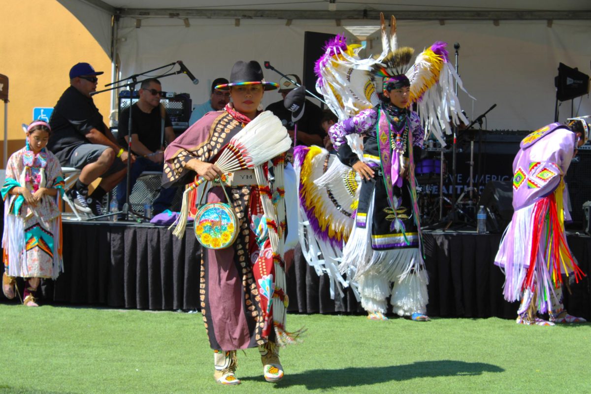 Dancer performing the northern traditional style dance at the Indigenous Red Market in Derby Ave. in Oakland, Calif., on Oct. 6,2024
