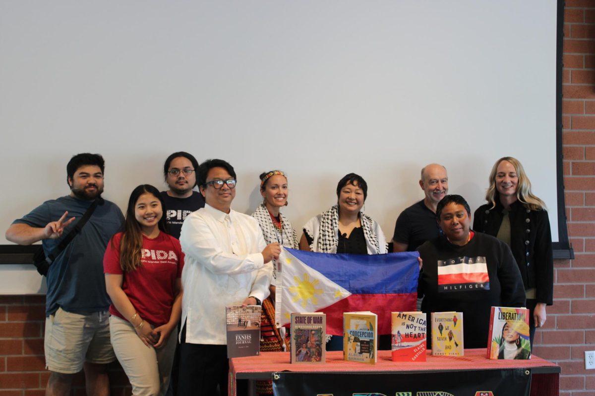 (Philippine Studies professor Lily Ann Villaraza poses with Contra Costa College’s APIDA club after a panel about Philippine history in San Pablo, Calif. on Monday, Oct. 14, 2024.