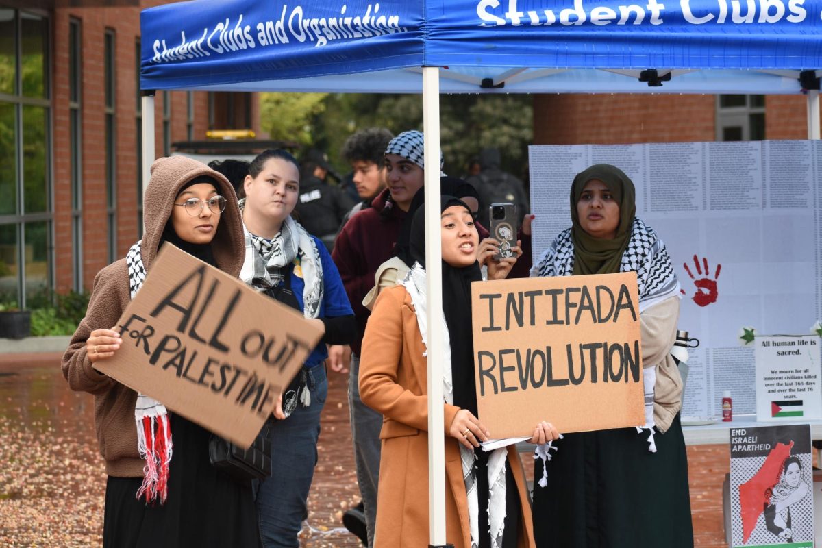 People who were supporting the demonstration with signs at Contra Costa College, San Pablo, Calif. Nov. 