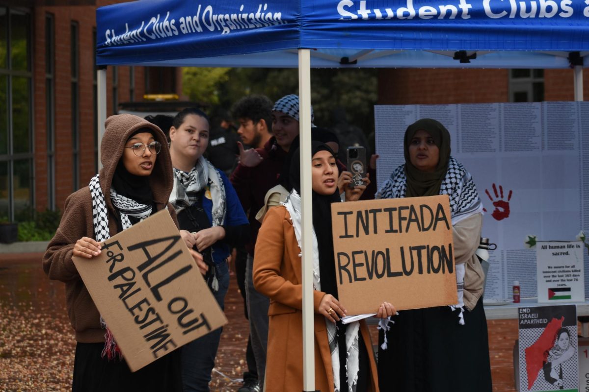 People who were supporting the demonstration with signs at Contra Costa College, San Pablo, Calif. Nov. 