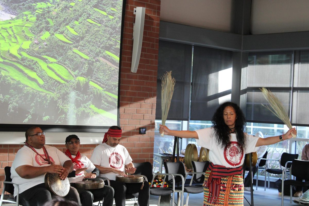 Manilatown playing the Gongs while performing the Shaman dance in the Fireside hall at Contra Costa College, San Pablo, Calif. on Oct. 30, 2024