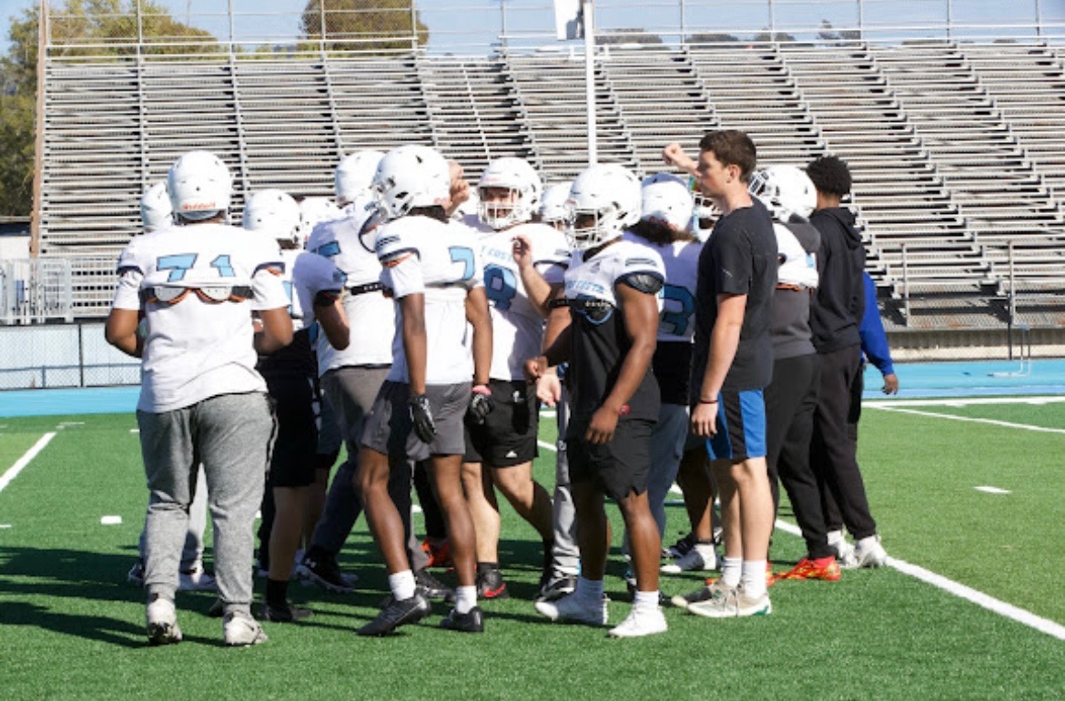 Coach giving a talk during huddle April 28 ,2025 - 5:19 p.m.