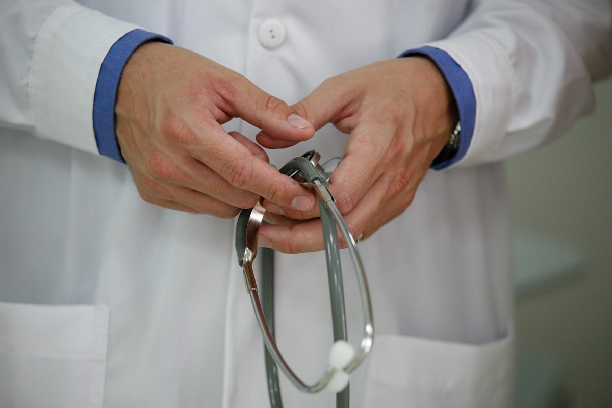 A physician in Peru is holding his stethoscope courtesy of wikimedia commons Alex Proimos