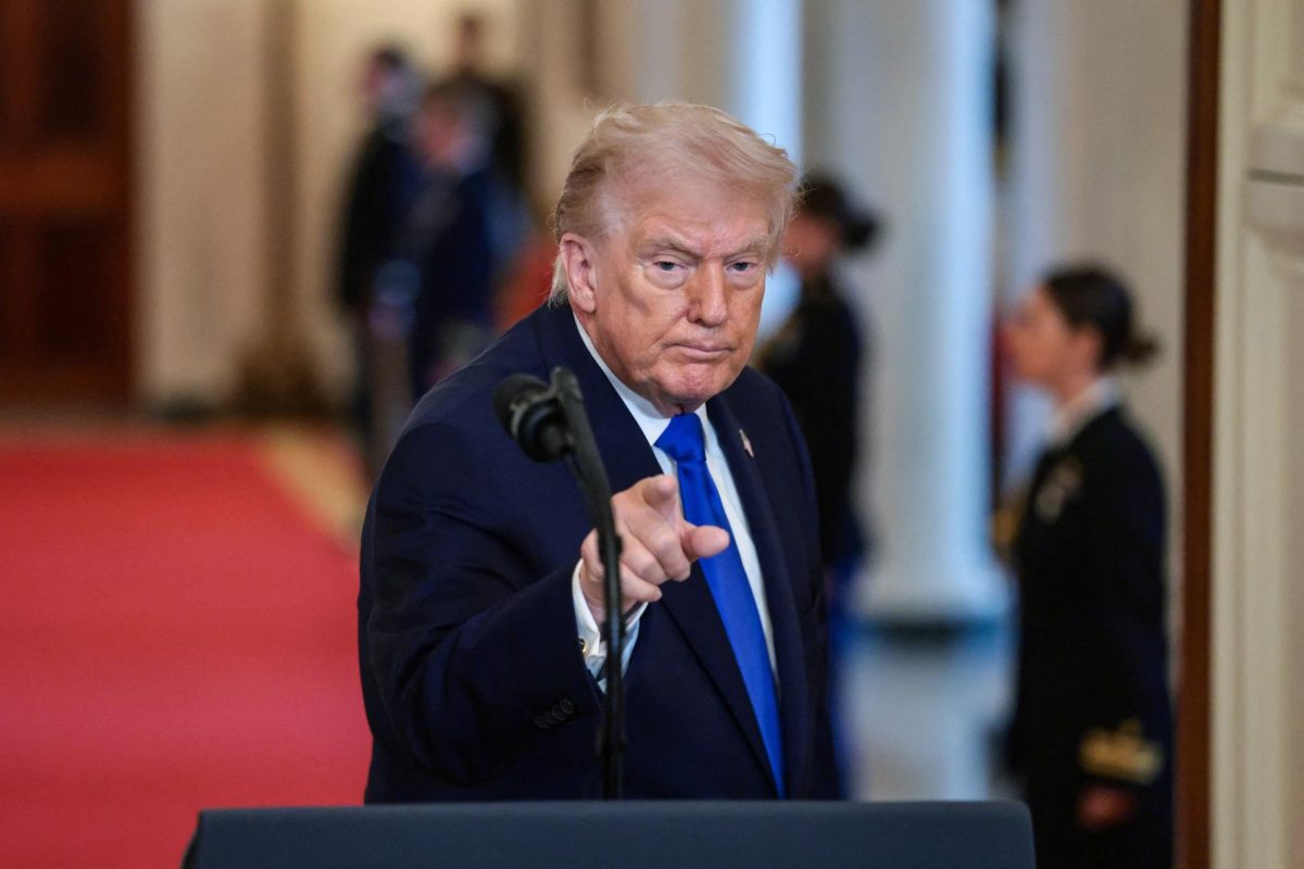 U.S. President Donald Trump gestures at the end of an event to honor "Angel Families" who have lost family members to crimes committed by people in the country illegally, at the White House in Washington, D.C., U.S., February 23, 2026. REUTERS/Evelyn Hockstein