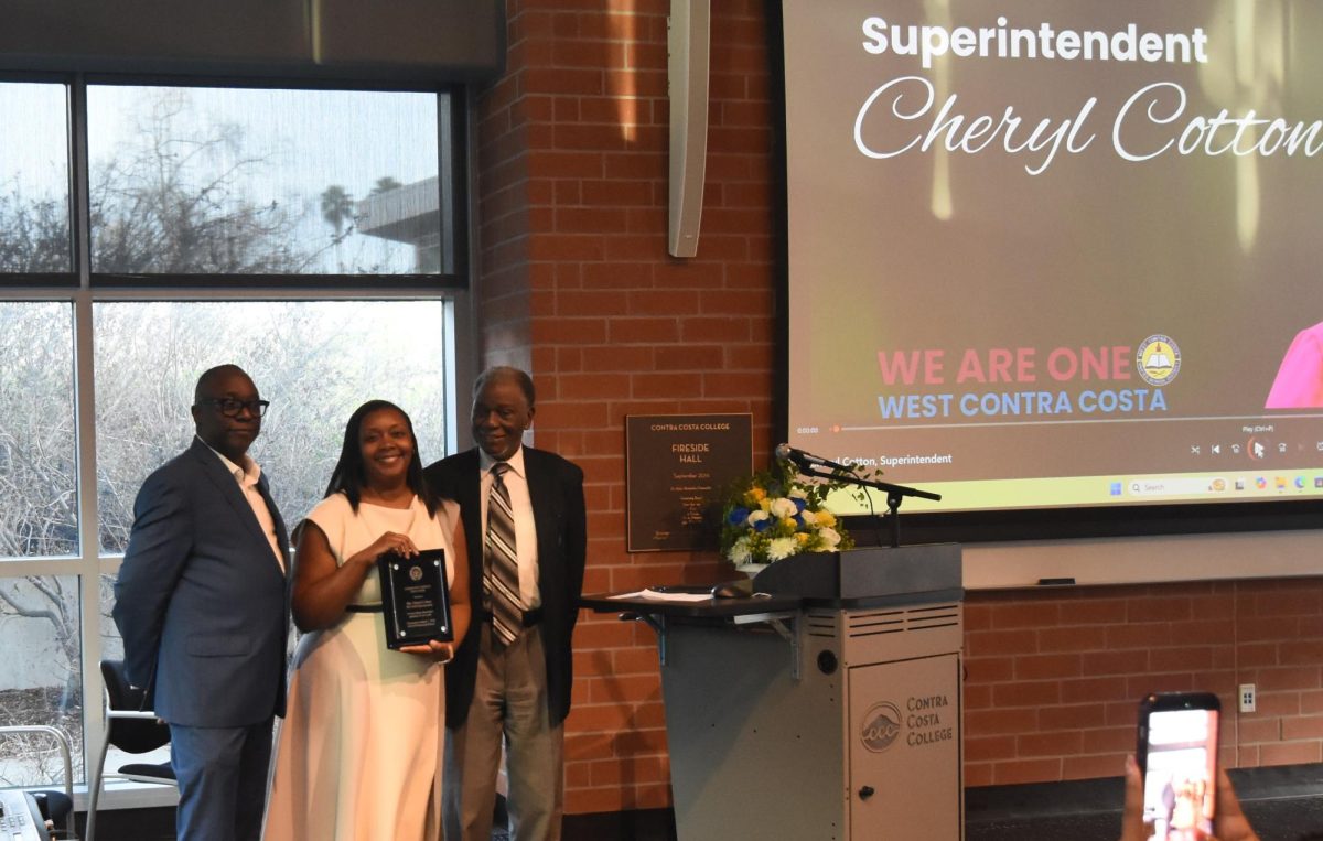 WCCUSD Superintendent, Cheryl Cotton (Center), pictured with her Community Leadership Award that was awarded by the Richmond NAACP Branch. -Credit. K. Trass, The Advocate
