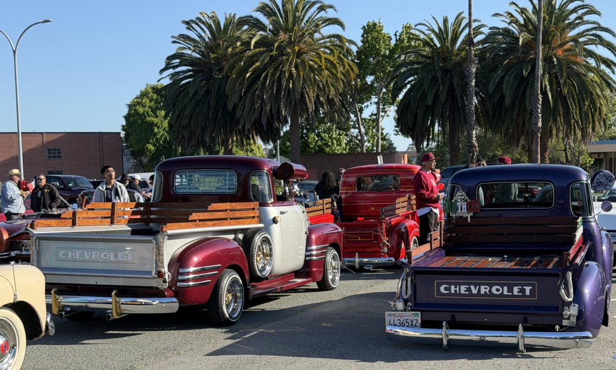 Red and purple Chevrolet truck at CCC parking lot 6 on Friday May 8,  5:52p.m. 