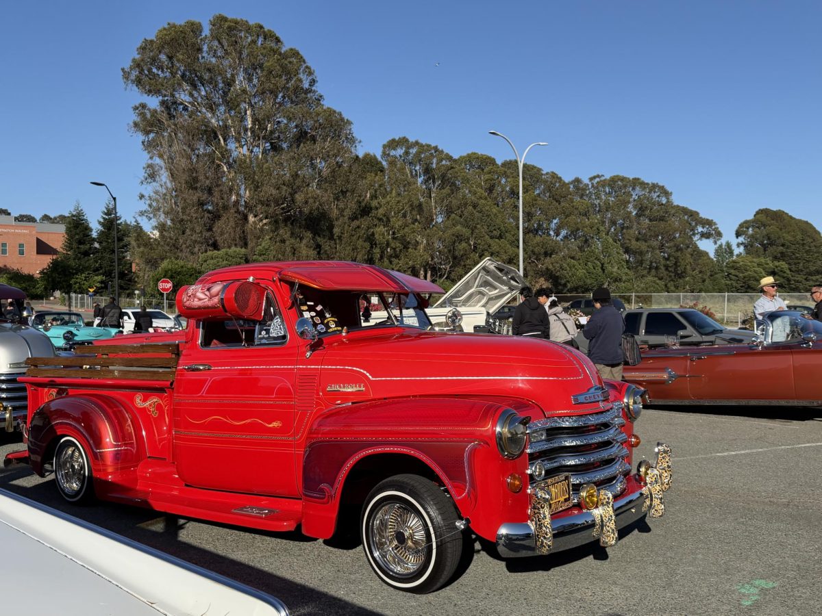 Bright red chevrolet truck at CCC parking lot 6 on Friday May 8, 5:54 p.m.