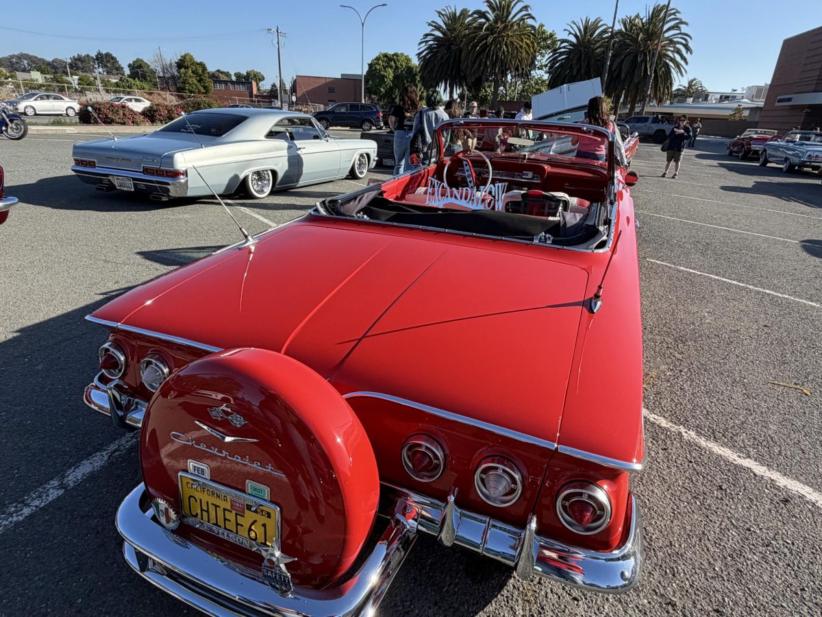 Bright red chevrolet Impala from car group excandalow, at CCC parking lot 6 on Friday May 8, 5:55 p.m.