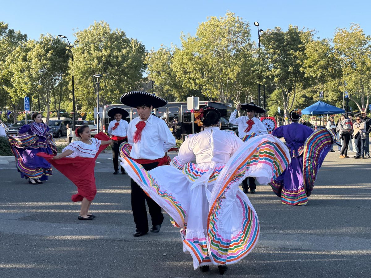 Alma Latina from Richmond high illustrated students  dancing folklorico in the parking lot 6 at CCC Friday May 8, 6:53p.m.