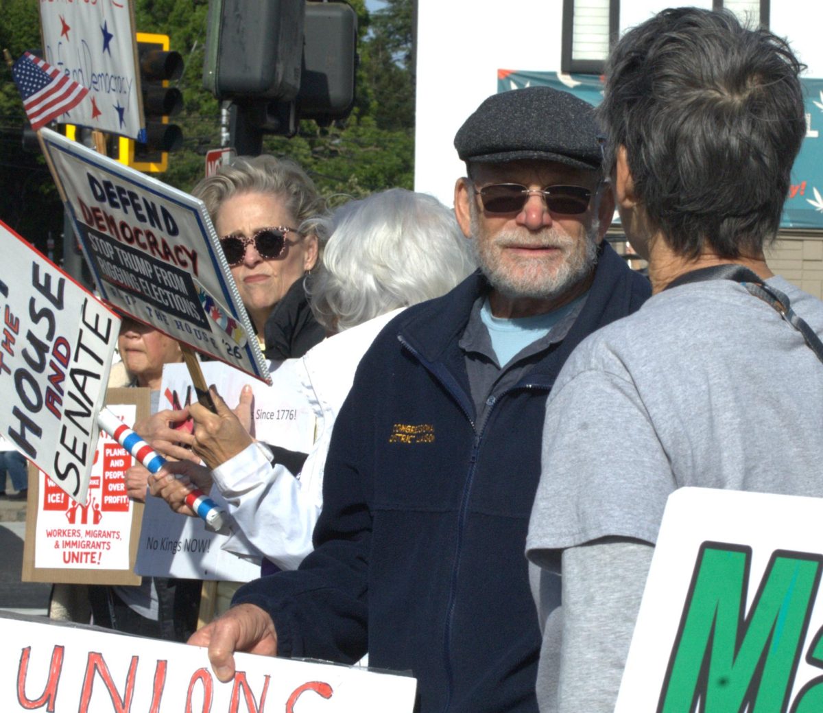 Neil Zarchin holds a sign at a May Day rally along San Pablo Dam Road and Appian Way in El Sobrante, Calif., on Friday, May 1, 2026. (Leon Watkins/The Advocate)
